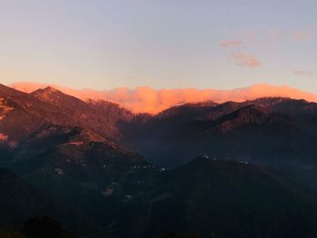 Scenic view of mountains against sky during sunset