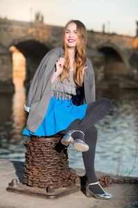 Portrait of smiling young woman in water