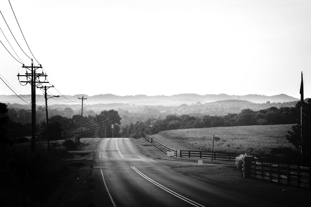 clear sky, transportation, road, electricity pylon, mountain, landscape, country road, power line, the way forward, mountain range, copy space, tree, tranquility, tranquil scene, electricity, nature, diminishing perspective, scenics, sky, countryside