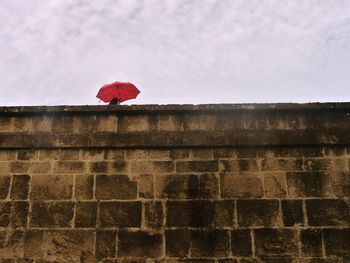Low angle view of red building against sky
