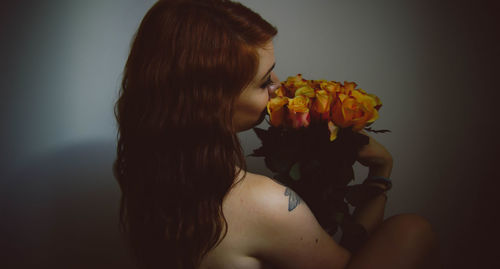 Midsection of man with flower