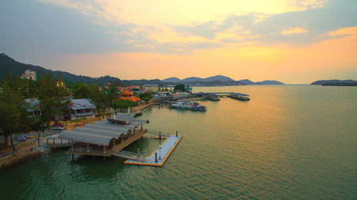 High angle view of boats in sea against sky during sunset