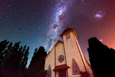 Low angle view of building against sky at night