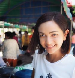 Portrait of smiling woman in market