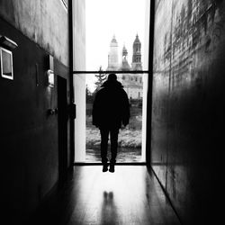 Full length of woman standing in building