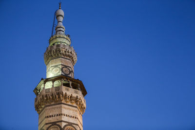 Low angle view of tower against clear blue sky