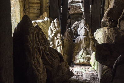 Statues on rock in building