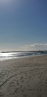 Scenic view of beach against clear sky