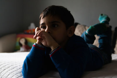 Portrait of child lying on the bed