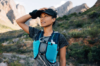 Young woman standing on mountain