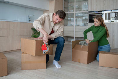 Side view of woman holding gift box