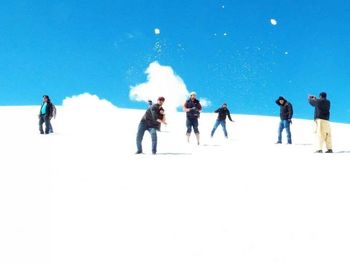 People on snow covered landscape