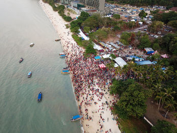 High angle view of trees by sea