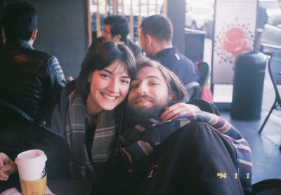 Portrait of a young couple sitting outdoors