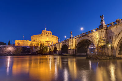 The castel sant angelo and the sant angelo bridge in rome at night