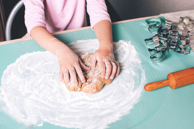 Midsection of woman preparing food on table