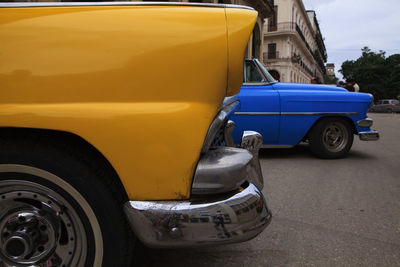 View of cars against cloudy sky
