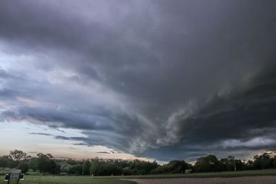 Storm clouds over field