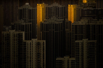 Full frame shot of modern buildings at night