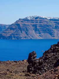 Scenic view of mountains against clear blue sky