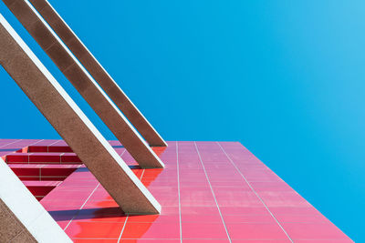 Low angle view of building against clear blue sky