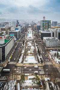 High angle view of street amidst buildings in city