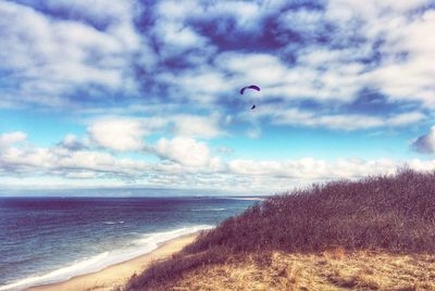 Scenic view of sea against cloudy sky