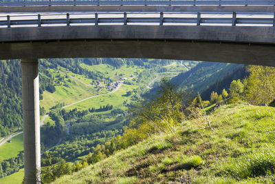 Scenic view of tree mountains against bridge