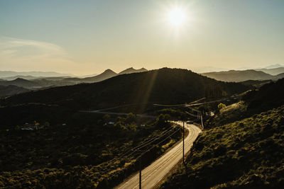 Aerial view of mountains against sky during sunset