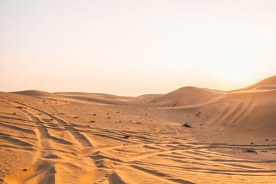 Scenic view of desert against clear sky