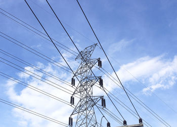 Low angle view of electricity pylon against sky