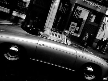 Cars on city street at night