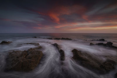 Scenic view of sea against sky during sunset