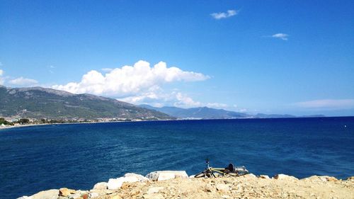 Scenic view of sea against cloudy sky