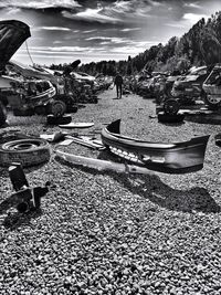 Boats moored on beach against sky