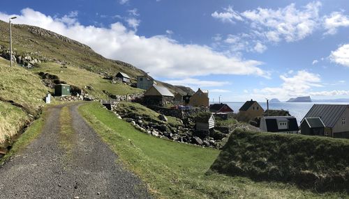 Panoramic shot of houses and buildings against sky