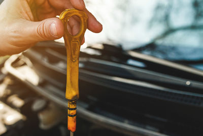 Cropped hand of man repairing car