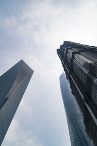 Low angle view of building against cloudy sky