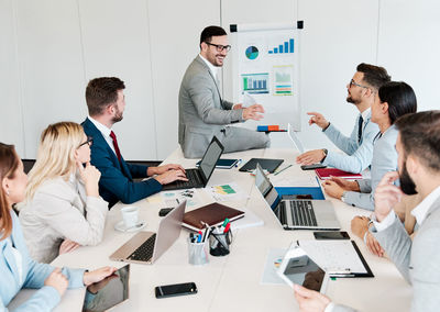 Business colleagues discussing during meeting in office