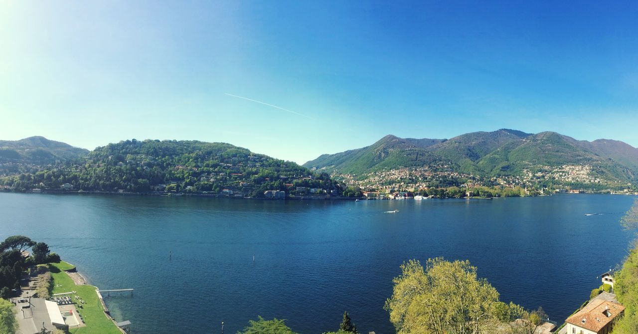 water, blue, reflection, beauty in nature, mountain, nature, lake, sky, tree, no people, scenics, day, tranquil scene, outdoors, nautical vessel, tranquility