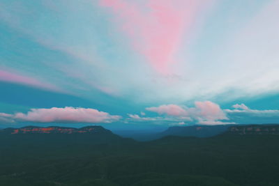 Scenic shot of mountain range against cloudy sky