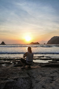 Sunset at papuma beach, jember, indonesia.