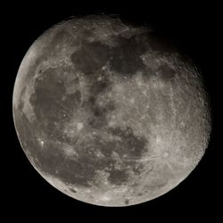 Low angle view of moon against sky at night