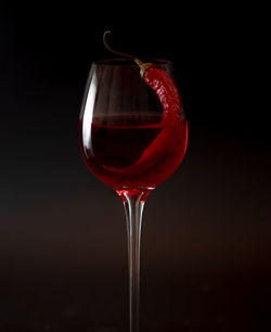 Close-up of red wine against black background