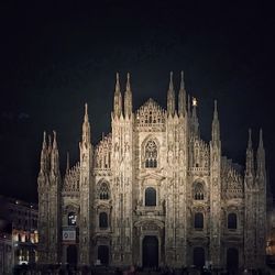 Facade of cathedral against sky at night