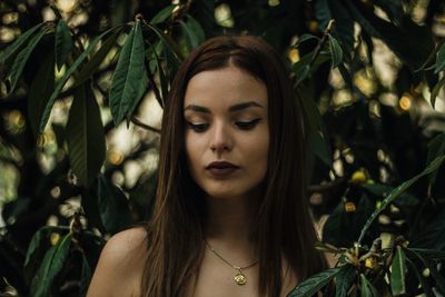 Beautiful woman amidst plants