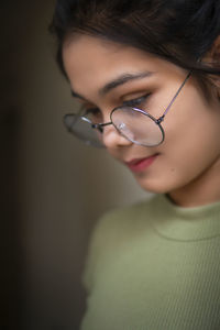 Close-up of young woman wearing sunglasses