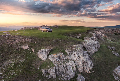 Scenic view of landscape against sky during sunset