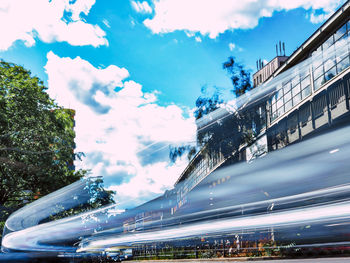 Panoramic view of bridge in city against sky