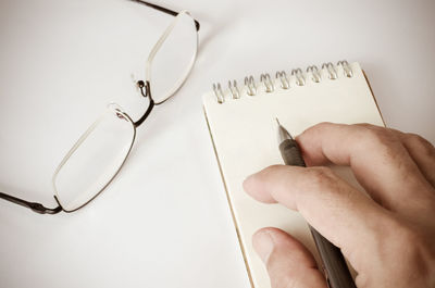 Close-up of hand holding paper